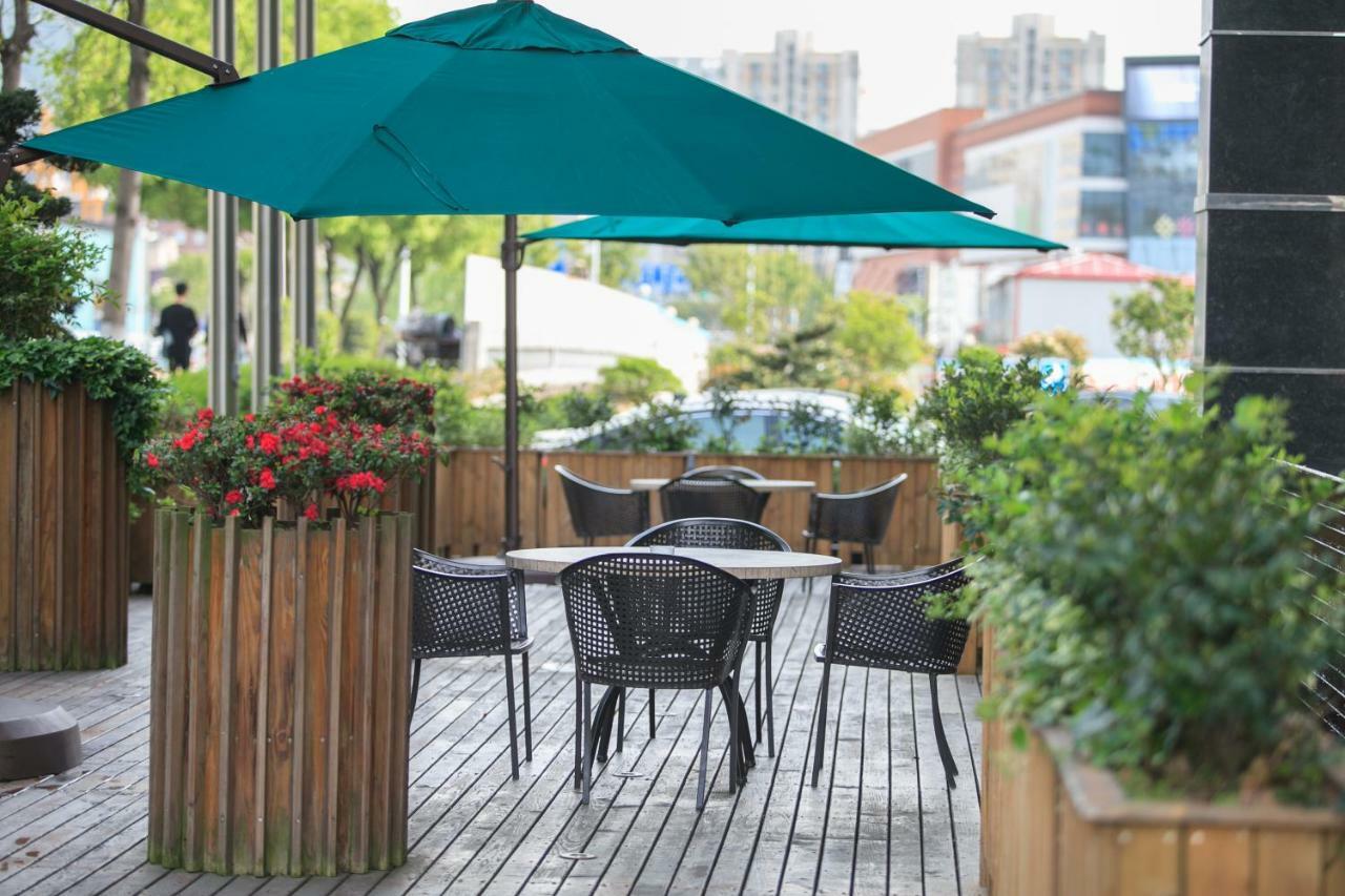 Four Seasons Rayli Hotel Нинбо Екстериор снимка