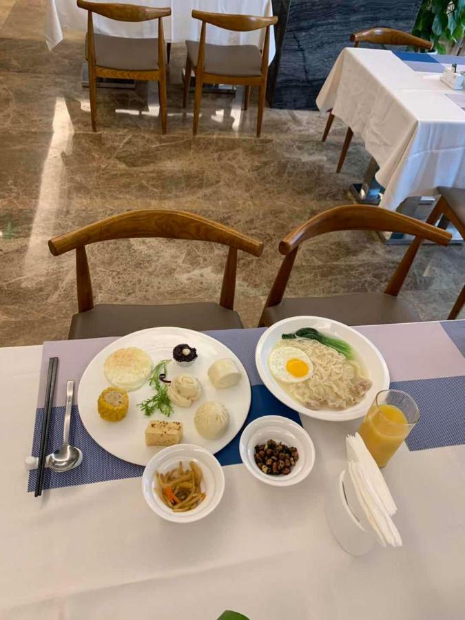 Four Seasons Rayli Hotel Нинбо Екстериор снимка